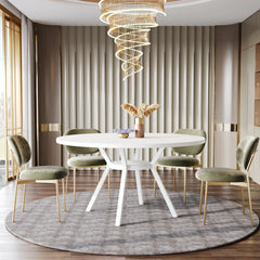 Modern dining room with a white table and green chairs, featuring a spiral chandelier.
