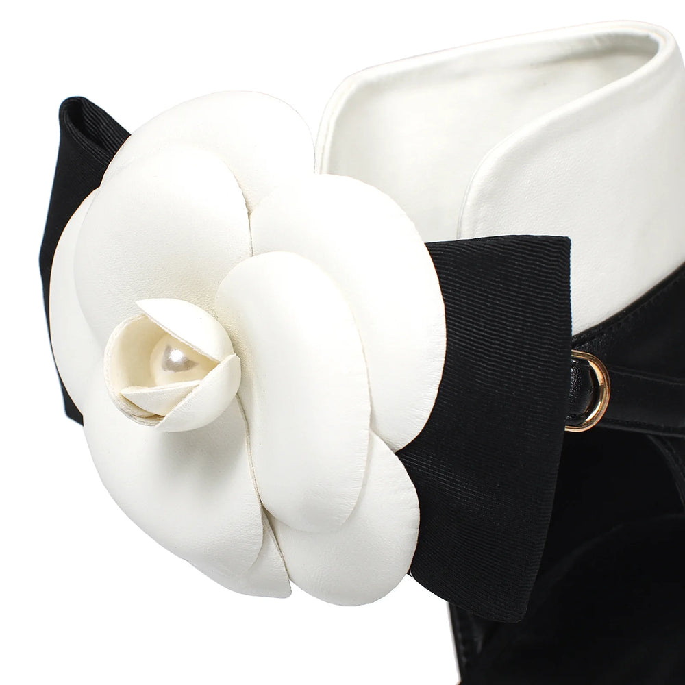 White flower accessory on a black background