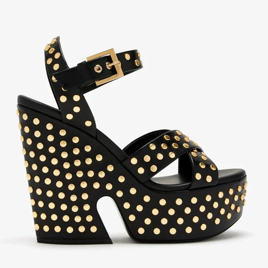 Black leather platform wedge sandal with gold stud embellishments and ankle strap