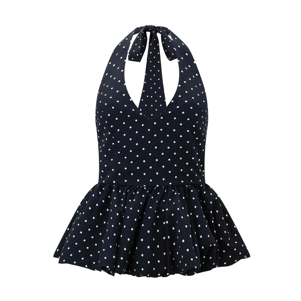 Black polka dot swimsuit with a halter neck design on a white background