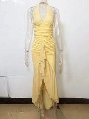 Yellow dress on a mannequin against a white background