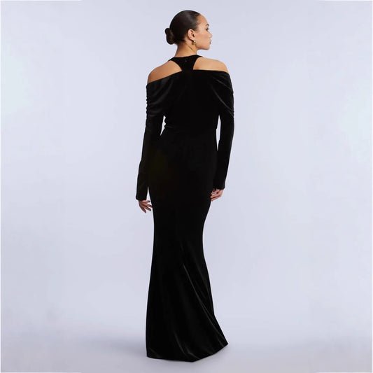 Back view of black velvet off-shoulder deep v-neck fishtail evening dress