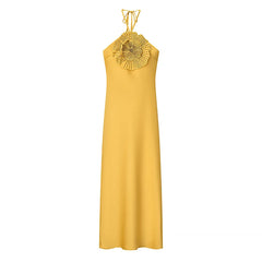 Yellow dress with a decorative neckline on a white background