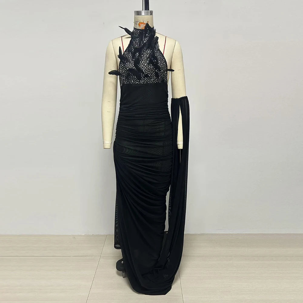 Mannequin display of feather halter neck ruched maxi dress