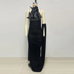 Mannequin display of feather halter neck ruched maxi dress