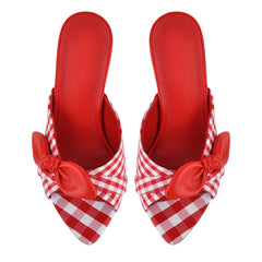 Top view of red and white gingham mules with bow accents.