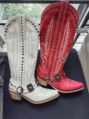 Pair of white and red embroidery buckle knee high boots