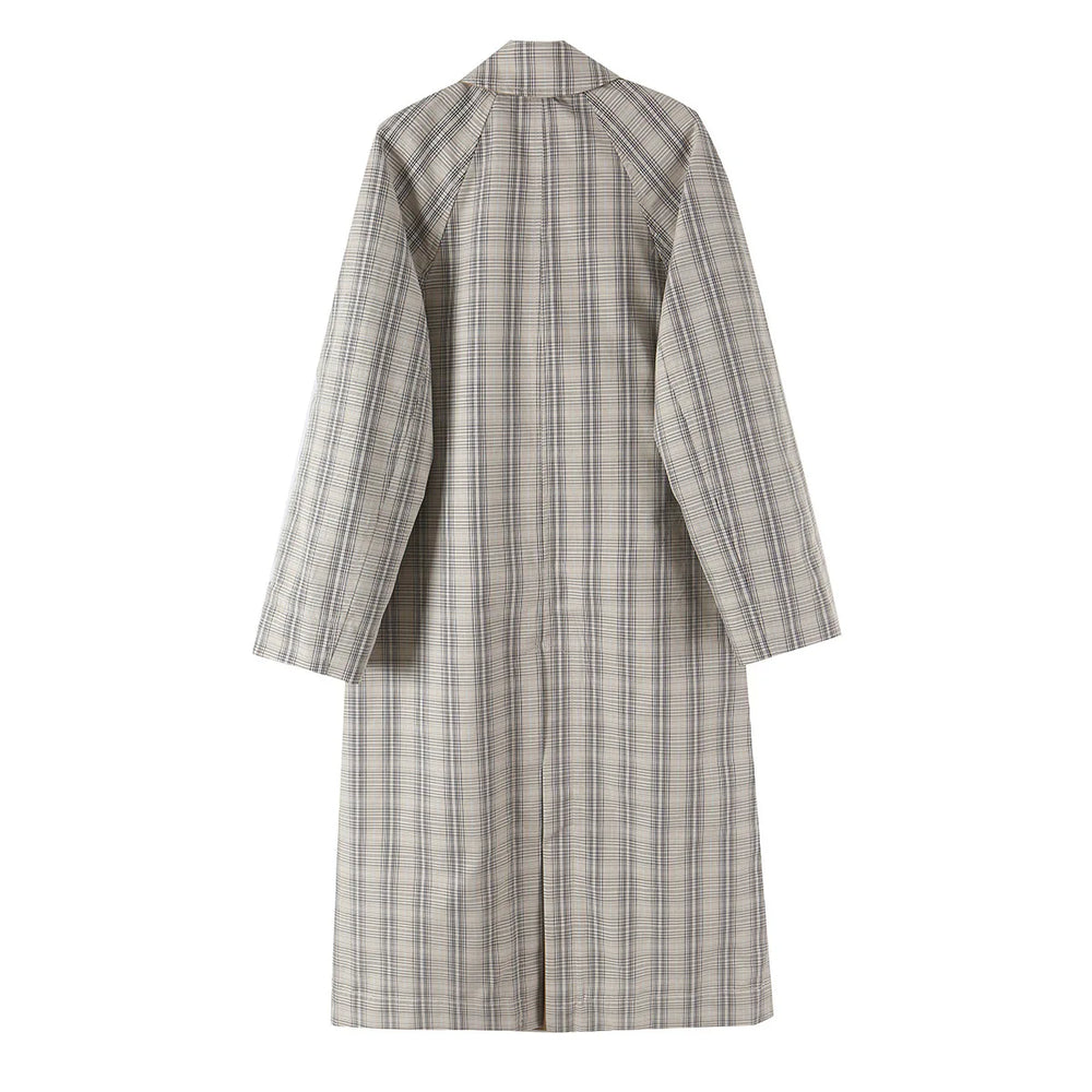 Back view of a reversible coat in plaid pattern.