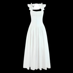 White dress with bow straps on a black background