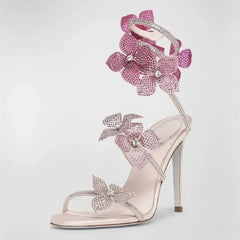 Side profile of a pink crystal flower ankle strap stiletto heel