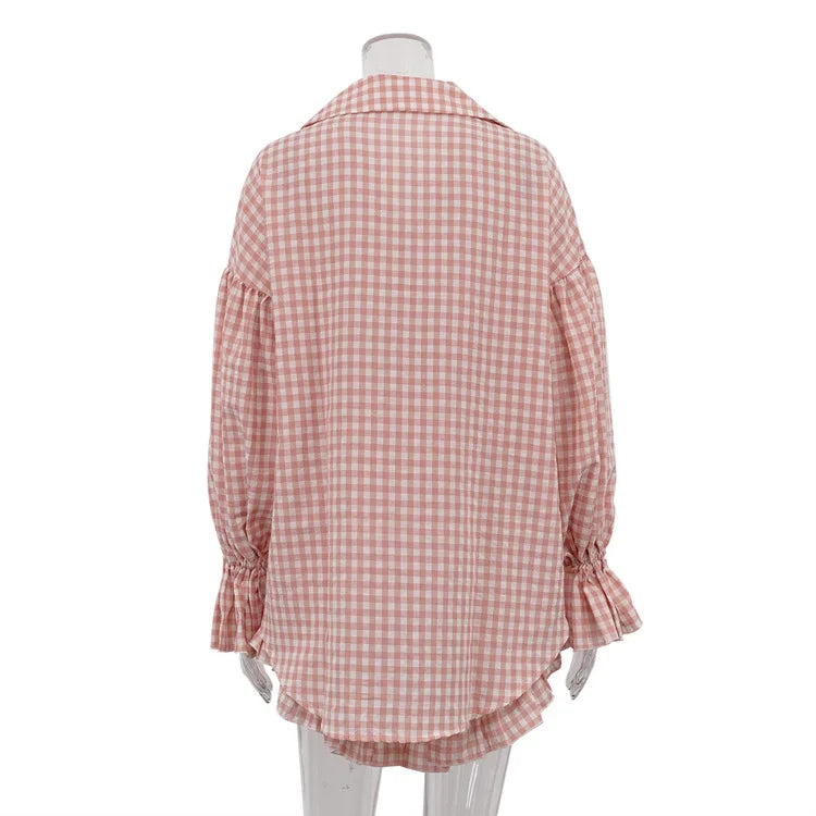 Red and white checkered shirt on a mannequin against a white background