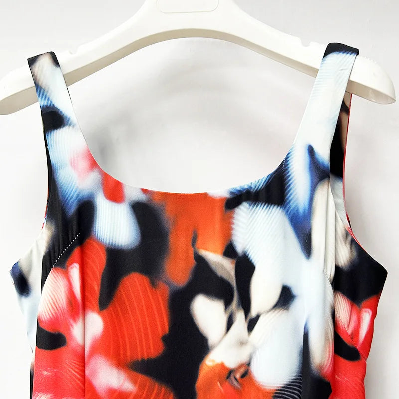 Colorful sleeveless top with abstract pattern on a hanger against a white background