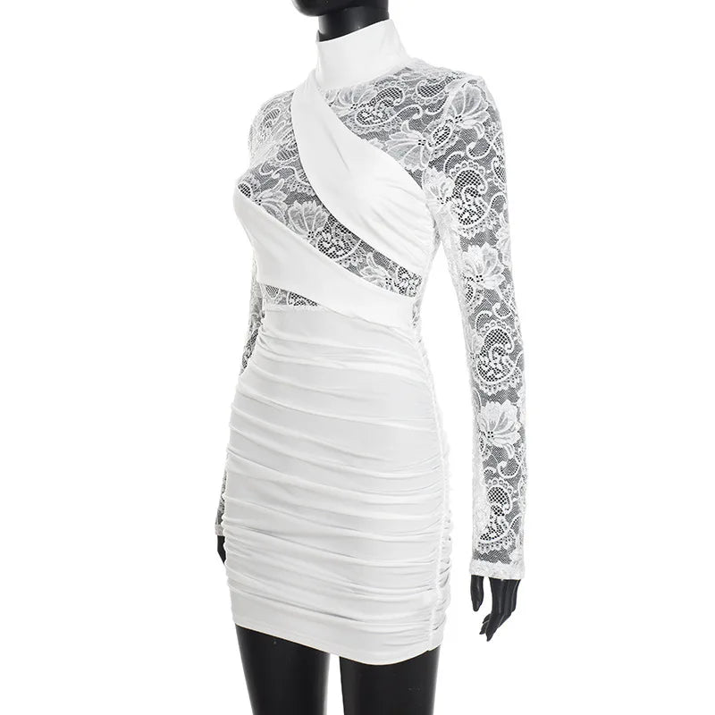 White dress with lace detailing on a mannequin against a white background