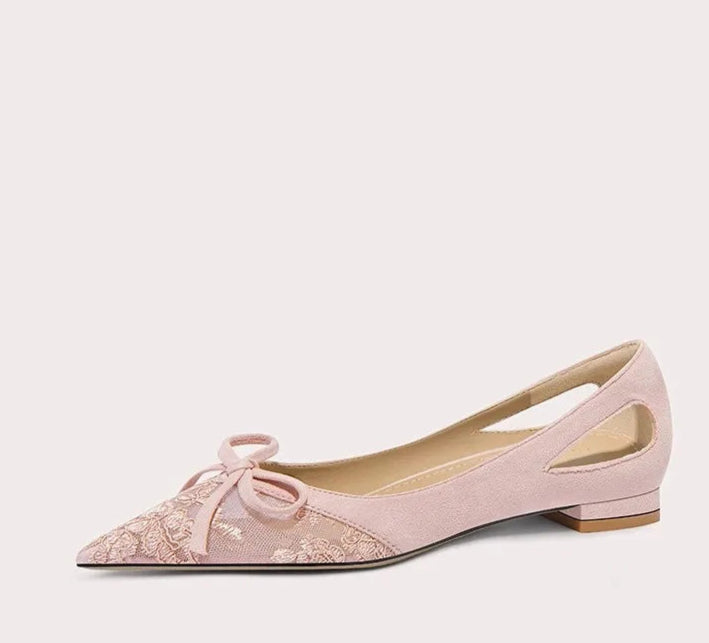 Pink flat shoe with floral design on a white background