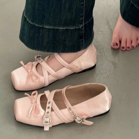 Square toe ballet flat in pink with cross straps and buckle detail
