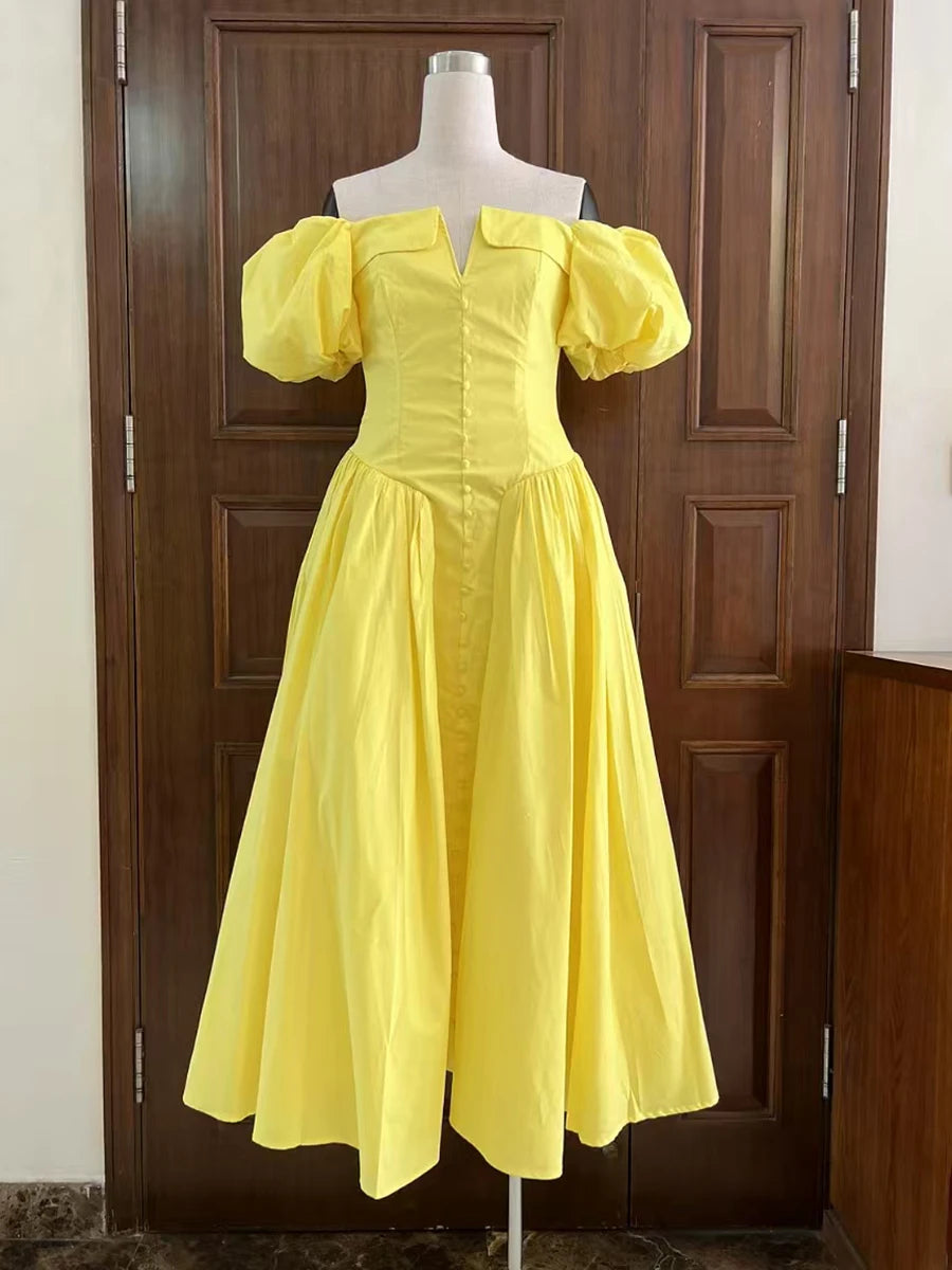 Yellow dress on a mannequin against a wooden door background