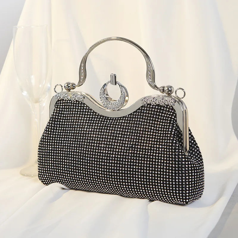 Black crystal-encrusted clutch bag with ring handle