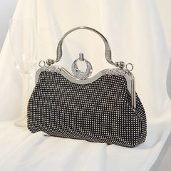 Black crystal-encrusted clutch bag with ring handle