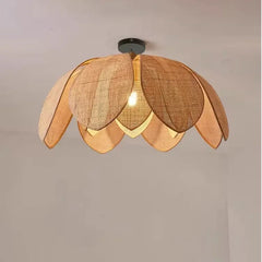 Bohemian rattan petal pendant light with handwoven wicker shade hanging from ceiling
