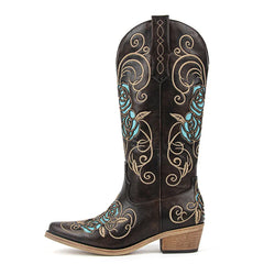 Brown cowboy boot with turquoise and gold embroidery on a white background