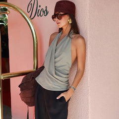 Draped halter neck sleeveless knit top with deep V-neckline