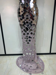 Silver sequin dress on a mannequin against a white background