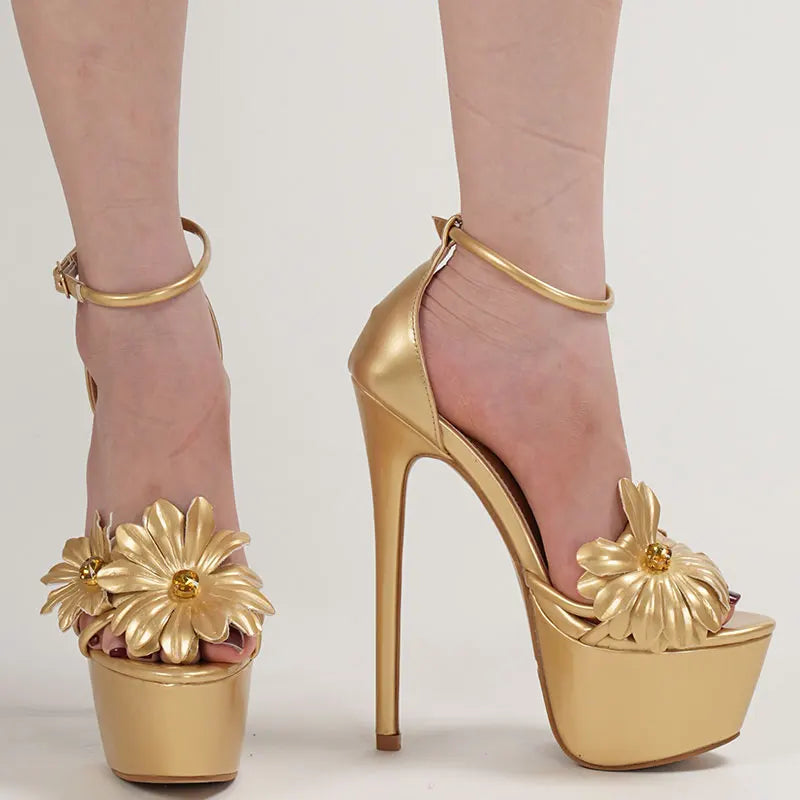 Gold high-heeled shoes with floral designs