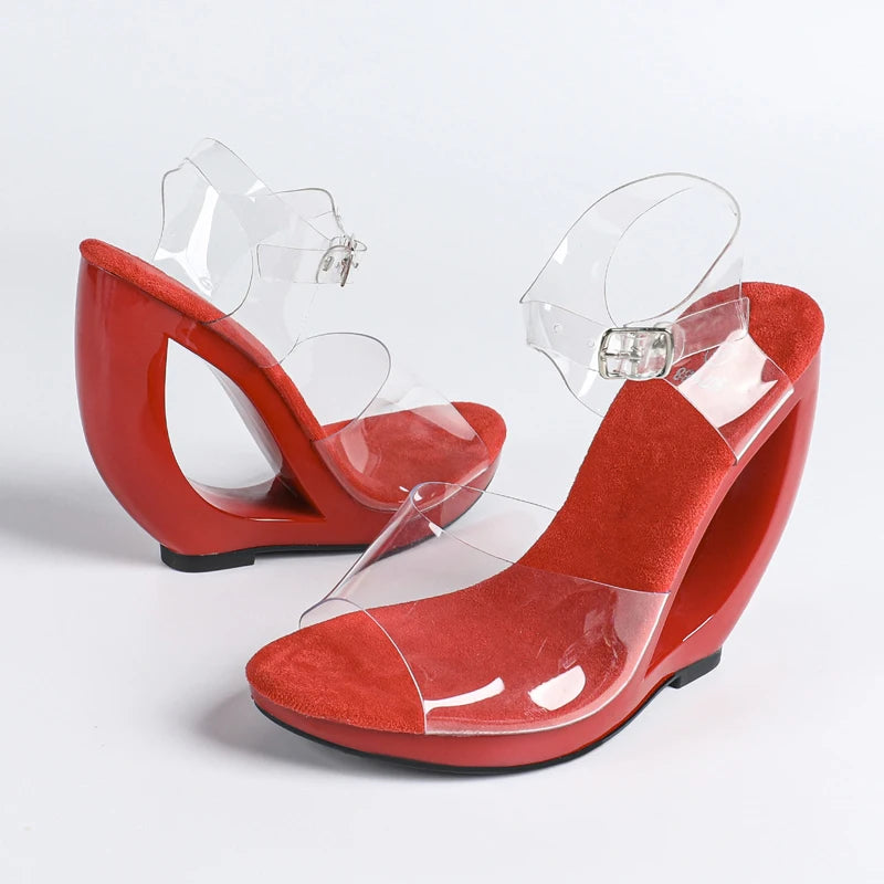 Red wedge sandals with clear straps on a white background