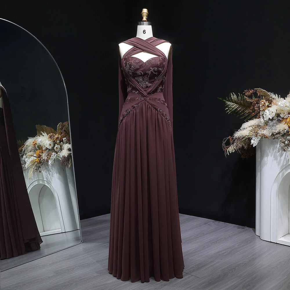 Chiffon evening dress with embroidered halter neckline on a mannequin.