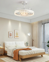 Modern bedroom with a ceiling light fixture, bed, and decor.