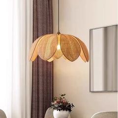 Bohemian rattan petal pendant light with handwoven wicker shade hanging from ceiling