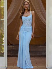 Model wearing a blue halter neck lace maxi dress
