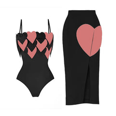 Black two-piece swimwear set with pink heart print details and a matching high-waisted bottom.