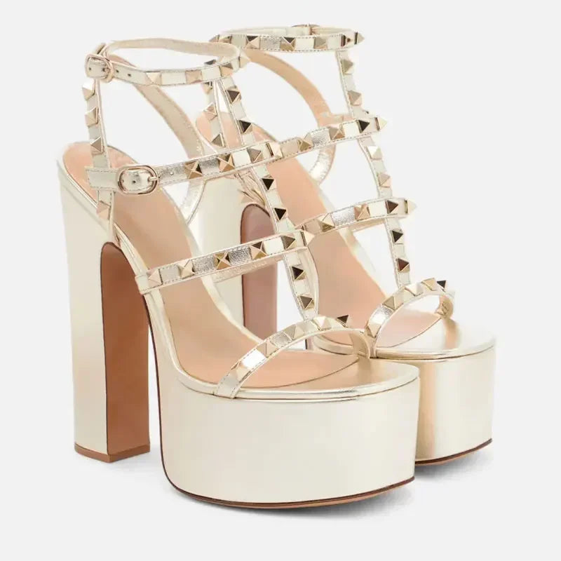 Gold high-heeled platform sandals with studded details 