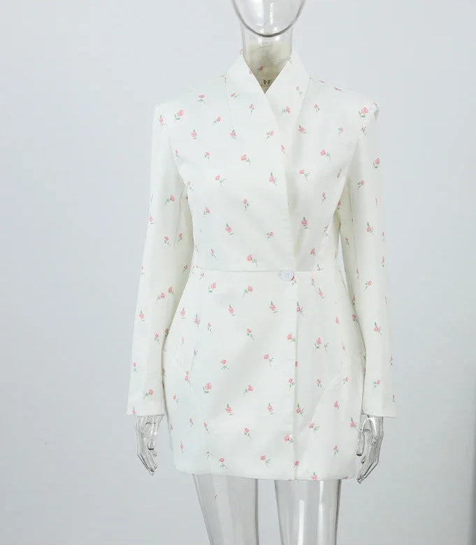 White floral blazer on a mannequin against a plain background