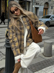 A woman wearing a stylish plaid wool coat with a turndown collar, perfect for fall. Golden Atelier 3