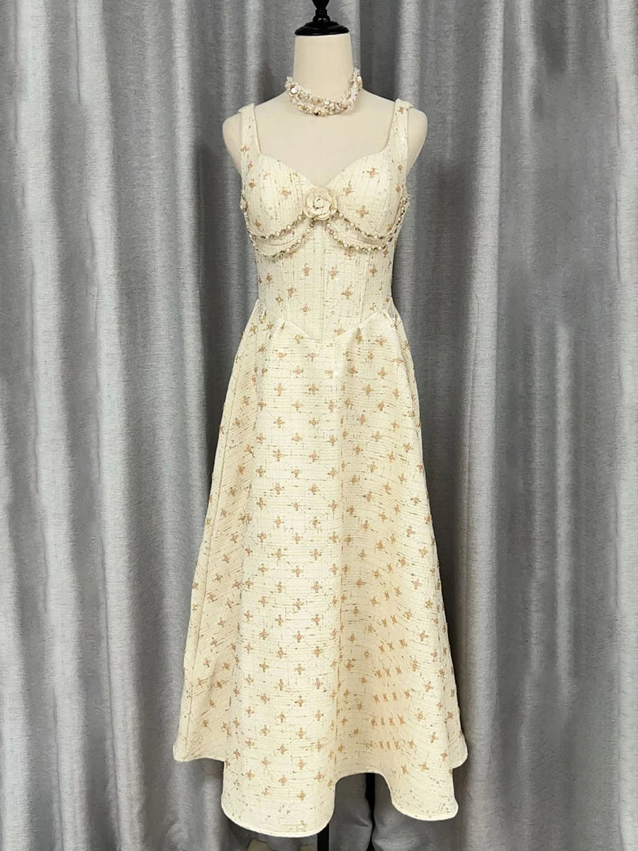 Sleeveless A-line ankle dress in textured cream fabric with subtle motifs
