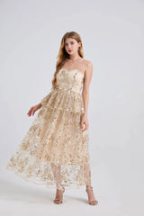 Woman wearing a beige strapless lace dress on a white background