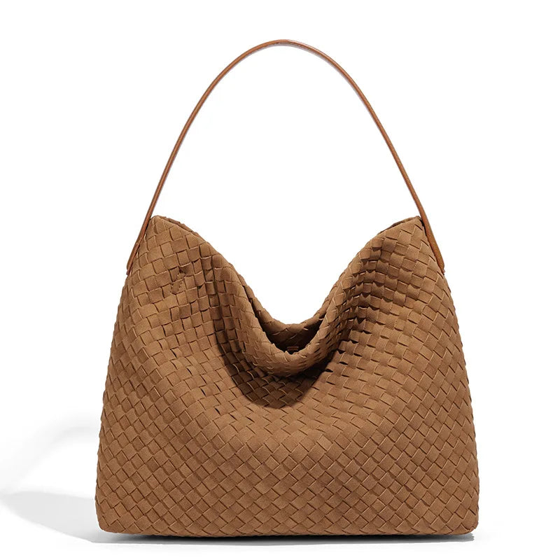 Brown woven handbag on a white background