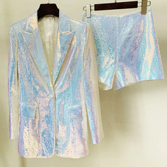 Iridescent sequin blazer and skirt set on hangers against a neutral background