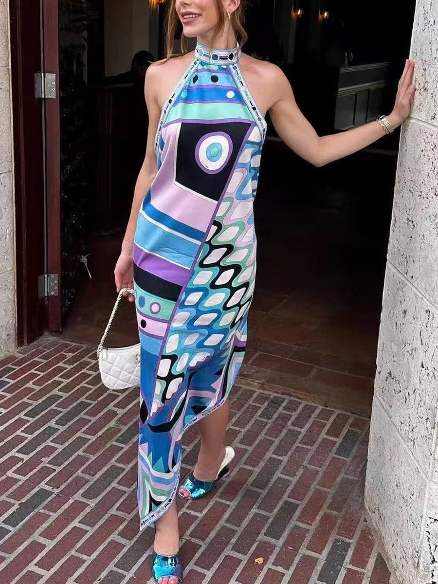 Model wearing a colorful abstract print halter neck maxi dress