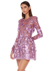 Close-up of purple floral embroidery on sheer mini dress