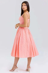 Woman wearing a pink dress on a white background