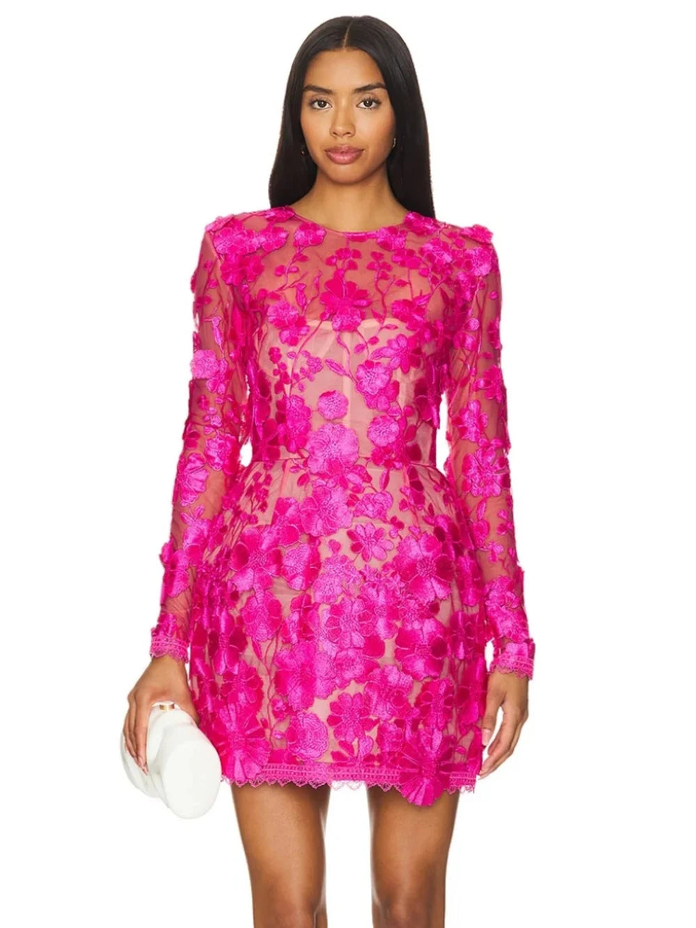 Pink floral embroidered sheer mini dress on model holding clutch