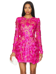 Pink floral embroidered sheer mini dress on model holding clutch