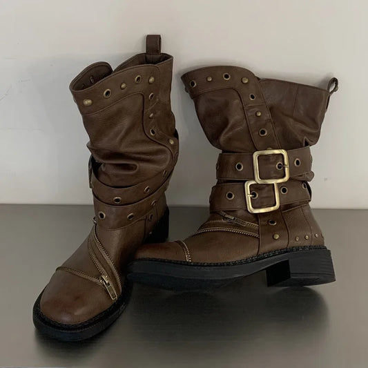Brown studded ankle boots with buckle and zipper details