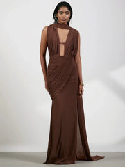 Brown draped halter neck folds gown, side profile