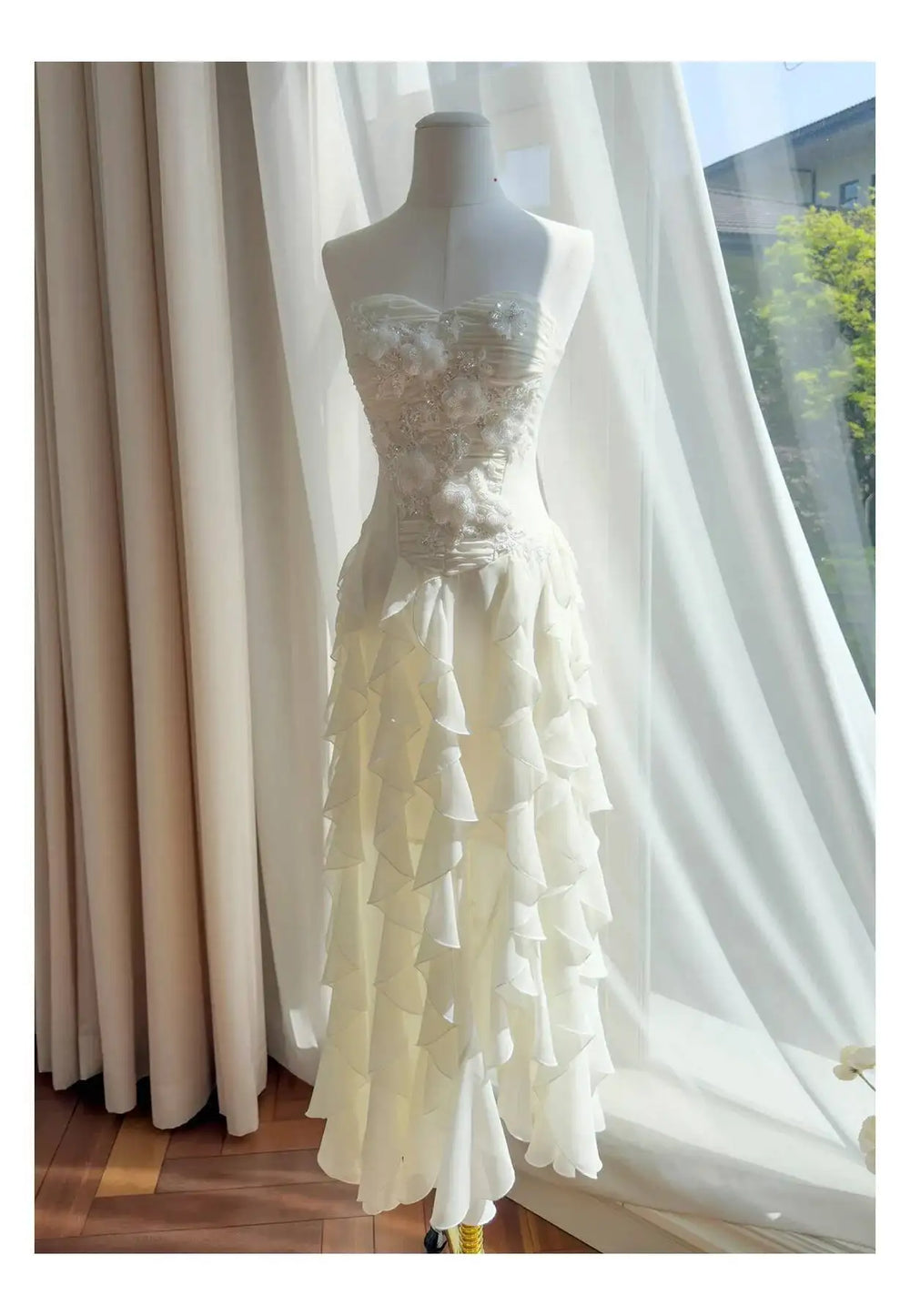 Strapless formal maxi dress with floral applique bodice and chiffon ruffles