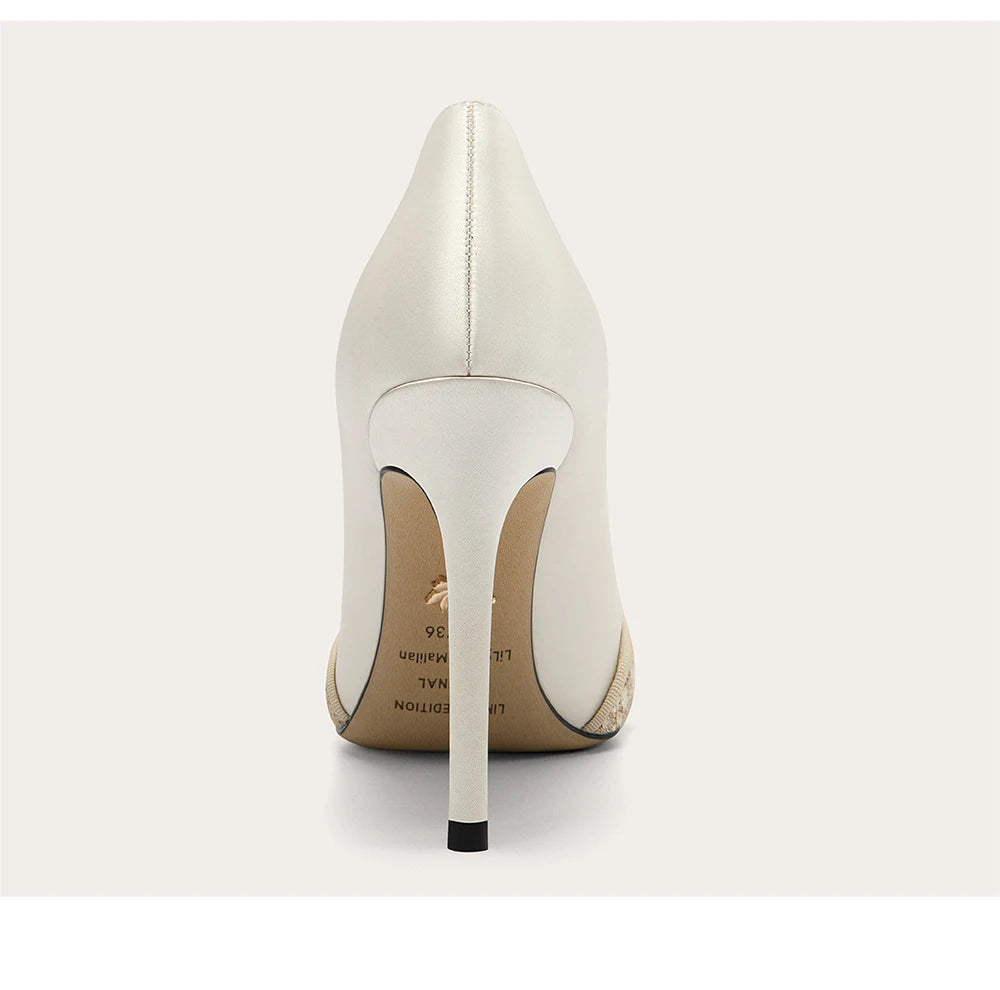 White high-heeled shoe on a white background