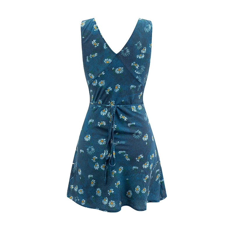 Back view of a sleeveless V-neck A-line mini dress with a blue background and white daisy print, featuring a tie detail.